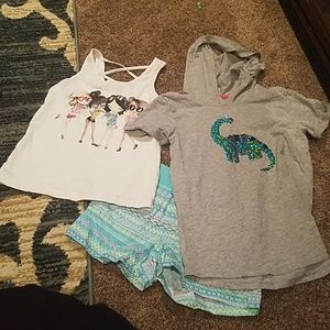One pair 6x/7 shorts, two size 7/8 shirts. 3 items